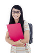 Attractive female student with backpack on white