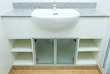 Ceramic handbasin on granite countertop