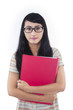Confident female student with red folder - isolated