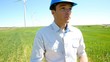 Video: Businessman checking on wind turbine energy production Businessman checking on wind turbine energy production