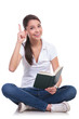 Casual Woman Sits & Reads ...