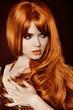 Healthy Long Hair. Beautiful woman with red curly hair and eveni