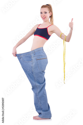 Photo: Dieting concept with oversize jeans Dieting concept with oversize jeans