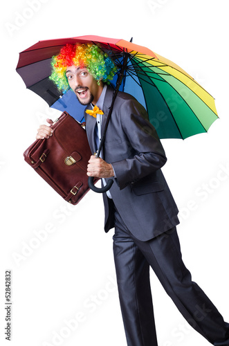 Photo: Clown businessman isolated on white Clown businessman isolated on white