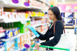 Woman checking food labelling