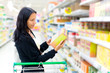 Woman checking food labelling