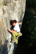 A man climbs a wall.