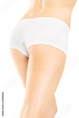 Photo: An attractive female legs isolated on white background An attractive female legs isolated on white background