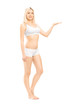 Young woman in cotton underwear gesturing with her hand