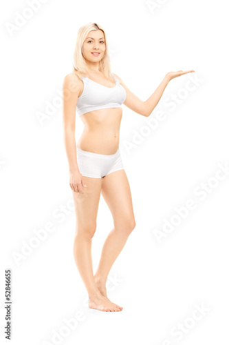 Photo: Young woman in cotton underwear gesturing with her hand Young woman in cotton underwear gesturing with her hand
