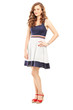 Young woman in dress posing and looking at camera