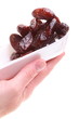 Dried date fruits in palm isolated