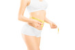 Foto: Young woman in white cotton underwear measuring her waist Young woman in white cotton underwear measuring her waist