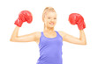Photo: Smiling female athlete wearing red boxing gloves Smiling female athlete wearing red boxing gloves