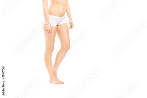 Photo: Young woman body in white cotton panties Young woman body in white cotton panties
