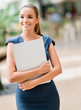 Photo: Business woman walking outdoors Business woman walking outdoors