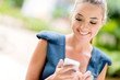 Business woman texting on her phone