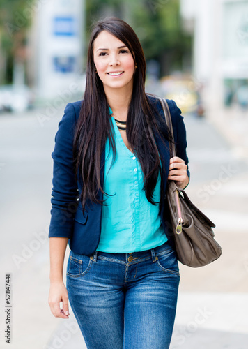 Photo: Woman walking outdoors Woman walking outdoors