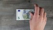 the new five euro note from 2013 on a table