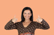 Attractive brunette woman saying Ok