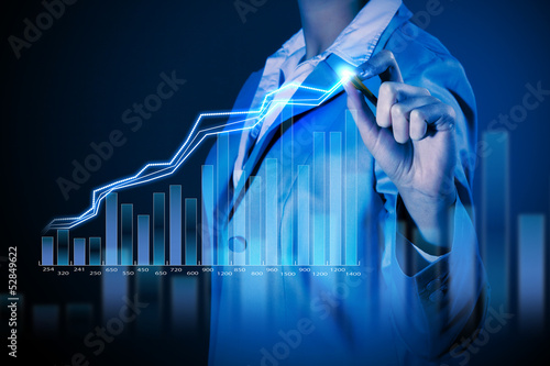 Photo: Business woman drowing media graphs Business woman drowing media graphs