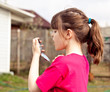 Photo : Upset 6 aged girl checking her milky teeth. Upset 6 aged girl checking her milky teeth.