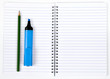 workbook with  felt-tip and pencil
