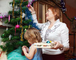 grandmother  and baby preparing for  Christma