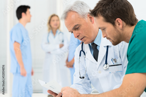Photo: Doctors Discussing In Meeting Doctors Discussing In Meeting