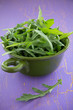Arugula salad in a sieve.
