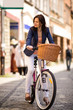 Urban biking - middle-age woman and bike in city
