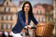 Urban biking - middle-age woman and bike in city
