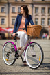 Urban biking - middle-age woman and bike in city