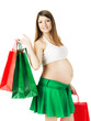 Beautiful pregnant woman with shopping bags over white
