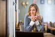 Photo: Woman Holding Coffee Cup While Looking Away Woman Holding Coffee Cup While Looking Away