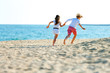 Children couple running on beach.