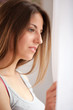 Foto: Beautiful caucasian woman looking at window Beautiful caucasian woman looking at window