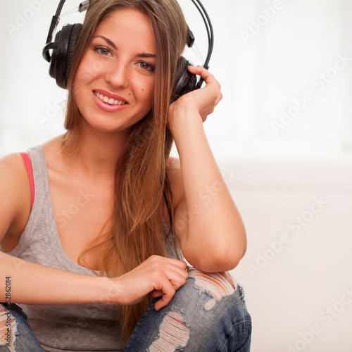 Photo: Beautiful woman enjoy music in headphones Beautiful woman enjoy music in headphones