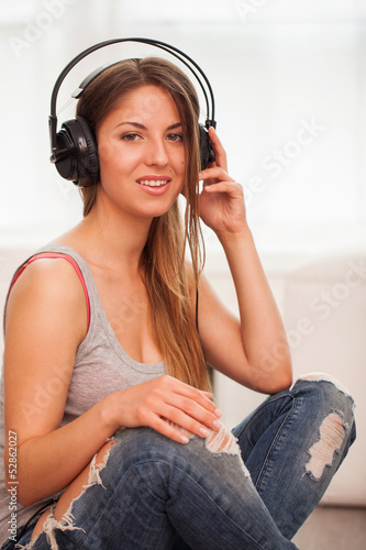 Photo: Beautiful woman enjoy music in headphones Beautiful woman enjoy music in headphones