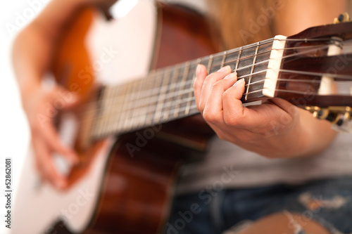 Photo: Closeup image of guitar in woman hands Closeup image of guitar in woman hands