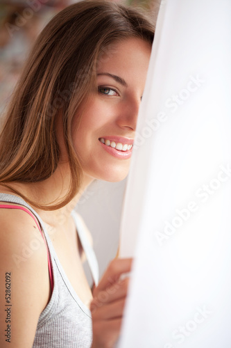 Photo: Beautiful caucasian woman looking at window Beautiful caucasian woman looking at window