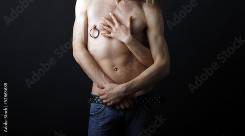 Photo: male body with a female hand male body with a female hand