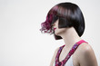 Woman with extravagant hairstyle in studio.