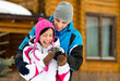 Photo: Half-length portrait of hugging couple who drinks tea outdoors Half-length portrait of hugging couple who drinks tea outdoors