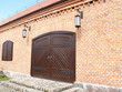 Brick facade with wooden gate