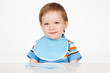 Boy with a spoon, on a gray background