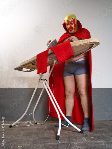 Photo: Mexican wrestler ironing his tights Mexican wrestler ironing his tights