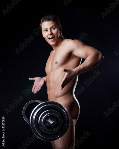 Photo: Portrait of astonished naked athlete with barbell Portrait of astonished naked athlete with barbell