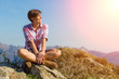 Photo: Young Woman at Top of Mountain Young Woman at Top of Mountain