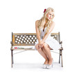 Photo: Melancholic woman all alone on bench chair Melancholic woman all alone on bench chair